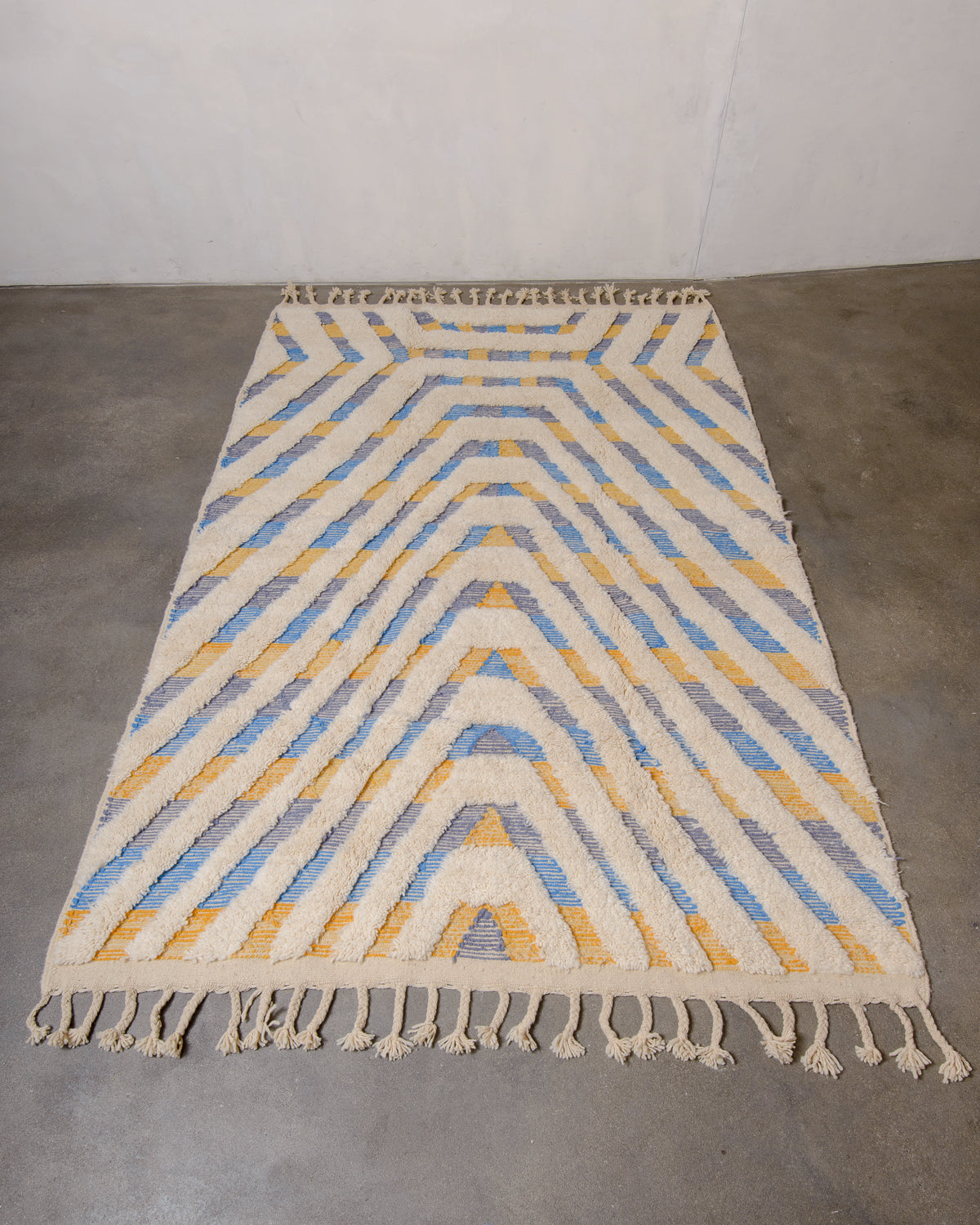 Modern, designer, handcrafted Berber rug from Morocco. Beniourain carpet with beautiful colours and patterns and fluffy wool texture.